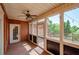 Relaxing screened porch with ceiling fan and wooden deck at 9157 Golfview Cir, Covington, GA 30014