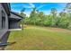 This backyard features a lawn with side views of the home at 157 Palisade Ne Dr, Rydal, GA 30171