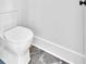 Close-up of a modern toilet and flooring in a well-appointed bathroom at 157 Palisade Ne Dr, Rydal, GA 30171