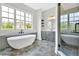 Elegant bathroom with soaking tub, shower, and stylish vanity at 157 Palisade Ne Dr, Rydal, GA 30171