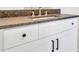 This elegant bathroom vanity has modern hardware, and a granite countertop at 157 Palisade Ne Dr, Rydal, GA 30171