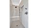 Modern bathroom showcasing tiled shower with built-in seat and matte black hardware at 157 Palisade Ne Dr, Rydal, GA 30171