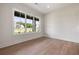 Bright bedroom with large window and hardwood floors at 157 Palisade Ne Dr, Rydal, GA 30171