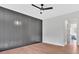 Bedroom featuring gray accent wall and view of bathroom at 157 Palisade Ne Dr, Rydal, GA 30171