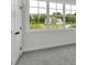 This is a bedroom with a large window that looks out onto a beautiful lawn at 157 Palisade Ne Dr, Rydal, GA 30171