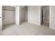 Spacious bedroom featuring neutral carpeting, crisp white trim and an open closet for ample storage at 157 Palisade Ne Dr, Rydal, GA 30171