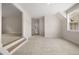 Bonus room with stairs and a large window, offering natural light and neighborhood views at 157 Palisade Ne Dr, Rydal, GA 30171