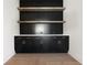Stylish black built-ins with shelves, drawers, and stone countertop at 157 Palisade Ne Dr, Rydal, GA 30171