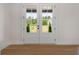 Bright entryway featuring double doors, hardwood floors, and a view of the outdoors at 157 Palisade Ne Dr, Rydal, GA 30171