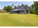 Charming two-story gray home with a large, well-manicured lawn and modern farmhouse appeal at 157 Palisade Ne Dr, Rydal, GA 30171