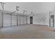 This spacious garage has two garage doors, overhead lighting, and room for storage at 157 Palisade Ne Dr, Rydal, GA 30171