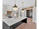 A spacious kitchen featuring a large island, pendant lights, and stainless steel appliances at 157 Palisade Ne Dr, Rydal, GA 30171