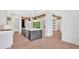 Open concept kitchen with stainless appliances, large island, and hardwood floors at 157 Palisade Ne Dr, Rydal, GA 30171