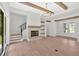 Stylish living room with hardwood floors, stone fireplace, staircase and French doors at 157 Palisade Ne Dr, Rydal, GA 30171