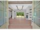 Open living room with hardwood floors, exposed beams, stone fireplace and large sliding doors at 157 Palisade Ne Dr, Rydal, GA 30171