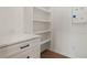 Built-in office nook with desk, shelving, and storage at 157 Palisade Ne Dr, Rydal, GA 30171