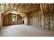 Unfinished room with exposed insulation, a window for natural light, and wiring, awaiting customization at 157 Palisade Ne Dr, Rydal, GA 30171