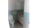 Bathroom featuring blue tiles and a mirrored vanity at 161 E 78 Hwy, Temple, GA 30179