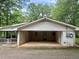 Home featuring an attached, enclosed carport that includes a screened in porch on the left at 161 E 78 Hwy, Temple, GA 30179