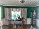 Bright living room with hardwood floors, green walls, and neutral-colored curtains at 161 E 78 Hwy, Temple, GA 30179