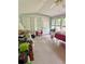 Bright sunroom featuring a ceiling fan and an abundance of natural light at 161 E 78 Hwy, Temple, GA 30179