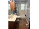 Bathroom with a single sink vanity and tub shower combo at 2579 Country Club Dr, Conyers, GA 30013