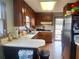 Eat-in kitchen features wood cabinets and ample counter space at 2579 Country Club Dr, Conyers, GA 30013