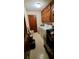 Small laundry room with washer, dryer, and cabinets at 2579 Country Club Dr, Conyers, GA 30013