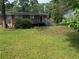 Backyard featuring a deck and lush green grass at 2903 Santa Barbara Dr, Decatur, GA 30032