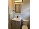 Updated bathroom boasts stylish vanity, mirror, and lighting at 2903 Santa Barbara Dr, Decatur, GA 30032