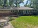 Charming brick home with manicured lawn and driveway at 2903 Santa Barbara Dr, Decatur, GA 30032