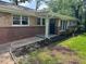 Home showcasing a front door and brick exterior with a manicured lawn at 2903 Santa Barbara Dr, Decatur, GA 30032