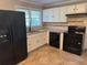 Kitchen featuring white cabinetry, stainless-steel appliances, and tile floors at 2903 Santa Barbara Dr, Decatur, GA 30032