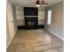 Living room showcasing a fireplace, built-in shelving, and ceiling fan at 2903 Santa Barbara Dr, Decatur, GA 30032