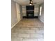 Cozy living room featuring a brick fireplace and built-in shelves at 2903 Santa Barbara Dr, Decatur, GA 30032