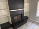 Cozy living room features a painted fireplace and built-in shelving at 2903 Santa Barbara Dr, Decatur, GA 30032