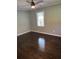 Main bedroom features dark wood flooring and ceiling fan at 2903 Santa Barbara Dr, Decatur, GA 30032