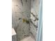 This shower features marble tile walls and brass hardware at 2903 Santa Barbara Dr, Decatur, GA 30032