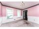 Dining room with wainscoting, two windows, chandelier and carpet at 3391 Quail Hollow Trl, Snellville, GA 30039