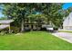 Inviting two-story home with a classic front porch and a lush green lawn at 3391 Quail Hollow Trl, Snellville, GA 30039