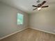 Bright bedroom with a ceiling fan and window for natural lighting at 5464 Fox Haven Trl, Stone Mountain, GA 30088