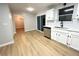 Bright kitchen with stainless steel dishwasher, and modern countertops at 5464 Fox Haven Trl, Stone Mountain, GA 30088