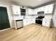 Well-lit kitchen featuring stainless steel appliances and modern countertops at 5464 Fox Haven Trl, Stone Mountain, GA 30088