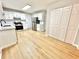 Updated kitchen with stainless steel appliances and bright white cabinets at 5464 Fox Haven Trl, Stone Mountain, GA 30088