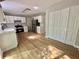 Bright kitchen featuring modern appliances, white cabinetry, and stainless-steel refrigerator at 5464 Fox Haven Trl, Stone Mountain, GA 30088