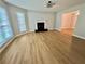Living room with large windows providing light, complemented by a classic fireplace at 5464 Fox Haven Trl, Stone Mountain, GA 30088