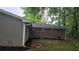 Backyard featuring vinyl siding and brick accents with lawn at 679 Winchester Ln, Norcross, GA 30071