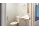 Bathroom features a toilet, vanity, mirror, and towel bar at 679 Winchester Ln, Norcross, GA 30071