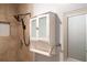 Bathroom features a shower with tile surround and decorative medicine cabinet at 679 Winchester Ln, Norcross, GA 30071