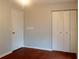 Bedroom with wood floors, closet and a painted wall at 679 Winchester Ln, Norcross, GA 30071